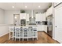 Modern kitchen with white cabinets, granite countertops, and stainless steel appliances at 20150 E Fair Ln, Centennial, CO 80016