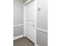 Hallway door with trim, baseboards, and a metallic silver letter A sign above at 909 N Logan St # 3A, Denver, CO 80203
