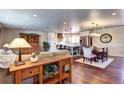 Open-concept living area seamlessly connects the living room, dining area, and kitchen at 13915 W 73Rd Ave, Arvada, CO 80005