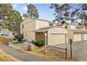 Charming townhome featuring an attached garage and well-maintained landscaping at 2754 S Kenton Ct, Aurora, CO 80014