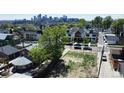 A vacant lot surrounded by greenery and modern homes, offering an investment opportunity in a vibrant neighborhood at 1735 W 37Th, Denver, CO 80211