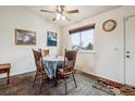 Bright dining area featuring a ceiling fan and natural light at 17703 E Nassau Pl, Aurora, CO 80013