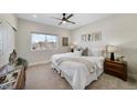 Bright main bedroom featuring a large window and comfortable furniture with lots of natural light at 1473 N Locust St, Denver, CO 80220