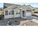 Beautiful home with stone accents, landscaping, and driveway leading to a garage, presenting an inviting curb appeal at 15776 Native Willow Dr, Monument, CO 80132
