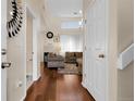 Inviting entryway featuring hardwood floors that lead to a cozy living room at 337 Ivory Cir, Aurora, CO 80011