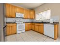 Functional kitchen with ample cabinet space, granite countertops, and modern appliances at 337 Ivory Cir, Aurora, CO 80011