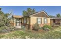 Charming brick home with well-maintained front yard and manicured landscaping at 2901 N Glencoe St, Denver, CO 80207