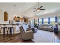 Bright living room with open-concept design, hardwood floors, and ample natural light at 5350 Clearbrooke Ct, Castle Rock, CO 80104