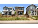 Charming two-story home with stone accents and a well-maintained front yard at 21044 E 63Rd Dr, Aurora, CO 80019