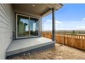 Patio featuring concrete floor and siding, providing outdoor access at 21044 E 63Rd Dr, Aurora, CO 80019