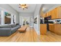 Inviting living space with hardwood floors, neutral walls, and an open layout to the kitchen at 1640 N Downing St # 103, Denver, CO 80218