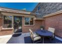Cozy outdoor patio with table and chairs, perfect for relaxing or entertaining guests at 30 Eagle Dr, Littleton, CO 80123
