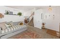 Inviting living room with a staircase, tasteful decorations, and ample natural light at 4393 E Andover Ave, Castle Rock, CO 80104
