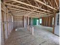 Bright, unfinished interior showcasing the home's frame, beams, and open layout ready for customization at 30 Waterford St, Erie, CO 80516