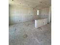 Spacious living room under construction with drywall and natural light from the windows at 30 Waterford St, Erie, CO 80516