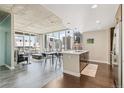 Open-concept kitchen with stainless steel appliances, white countertops, and city views at 891 14Th St # 1408, Denver, CO 80202