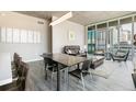 Open-concept living and dining area showcasing modern decor and city views from large windows at 891 14Th St # 1408, Denver, CO 80202