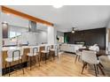 Open concept living space blending the kitchen, dining, and living areas, ideal for entertaining at 3210 Magnolia St, Denver, CO 80207