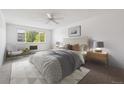 Bright bedroom with a large window, neutral decor, and a comfortable queen-sized bed at 660 S Alton Way # 3B, Denver, CO 80247