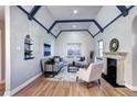 Elegant living room with hardwood floors, fireplace, and beamed ceilings, offering a cozy and stylish space at 1378 Forest St, Denver, CO 80220