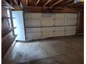 Spacious two-car garage with overhead storage and ample room for parking at 11196 E Baltic Dr, Aurora, CO 80014