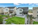 Spacious backyard with green lawn, gravel area, and a wooden fence at 624 Simmental Loop, Castle Rock, CO 80104