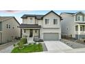 Charming two-story home with a well-maintained front yard and a cozy porch at 624 Simmental Loop, Castle Rock, CO 80104