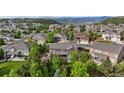 Residential neighborhood aerial showcases lush trees, well-maintained homes and mountain views in the distance at 7408 Sodalite Way, Castle Rock, CO 80108