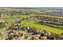 Aerial view of a home near a golf course, with green lawns and neighborhood streets at 23060 Hope Dale Ave, Parker, CO 80138