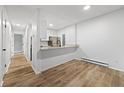 Living space with an open view to the kitchen, bright lighting and vinyl floors at 14720 E Kentucky Dr # 612, Aurora, CO 80012