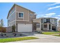 Two story home with attached garage, stone accents, and a nicely landscaped yard at 17919 Dandy Brush Dr, Parker, CO 80134