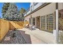 Inviting outdoor space with a cozy patio, seating, and a private fenced area at 7559 S Ivanhoe Cir, Centennial, CO 80112