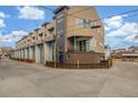 Street view of modern townhouses featuring neutral tones, balconies, and individual entrances at 3142 W 20, Denver, CO 80211