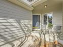 Cozy front porch with seating area, perfect for enjoying the outdoors at 12819 E Dickensen Pl, Aurora, CO 80014