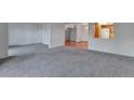 Spacious living room with carpet and access to balcony at 13601 E Marina Dr # 404, Aurora, CO 80014