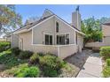 The home's exterior features neutral siding and a cozy patio area with well-kept landscaping at 2491 S Xanadu Way # A, Aurora, CO 80014