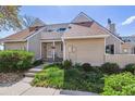 Charming home featuring well-maintained landscaping and a welcoming front porch at 2491 S Xanadu Way # A, Aurora, CO 80014