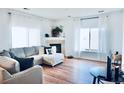 Bright living room with hardwood floors, fireplace and ample natural light at 14700 E 104Th Ave # 2605, Commerce City, CO 80022