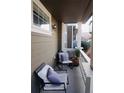 Cozy front porch features comfortable seating, perfect for relaxing at 14700 E 104Th Ave # 2605, Commerce City, CO 80022