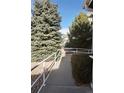 Sidewalk path with trees and shrubs at 14700 E 104Th Ave # 2605, Commerce City, CO 80022