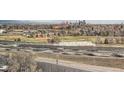 Scenic view of the surrounding neighborhood with city skyline in the distance at 2225 Buchtel Blvd # 1003, Denver, CO 80210