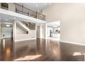 Expansive living room boasts hardwood floors, a staircase, and an open layout at 23870 E Dorado Pl, Aurora, CO 80016