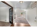 Bright entryway with hardwood floors, high ceilings, and a view into the spacious living area at 7171 Canyon Way, Frederick, CO 80504