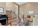 Inviting living room with plush seating, stylish decor, and an elegant chandelier at 11615 E Maplewood Ave, Englewood, CO 80111