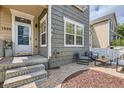 Inviting front porch with stylish seating area, perfect for relaxing and enjoying the outdoors at 1539 Bennet Mountain Rd, Castle Rock, CO 80109