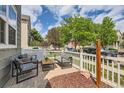 Comfortable front porch seating with a view of the neighborhood and beautiful trees at 1539 Bennet Mountain Rd, Castle Rock, CO 80109