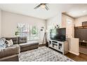 Bright and inviting living room with hardwood floors, stylish decor, and ample natural light at 1539 Bennet Mountain Rd, Castle Rock, CO 80109