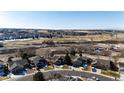 Aerial shot featuring homes in a planned community with open space and landscaping at 23612 Glenmoor Dr, Parker, CO 80138