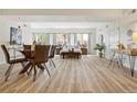 A bright open-concept bedroom includes a dining area and a desk near a door at 2901 N Wyandot St # 19, Denver, CO 80211