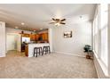 Inviting living area with seamless flow into kitchen and great natural light at 6745 S Winnipeg Cir # 103, Aurora, CO 80016